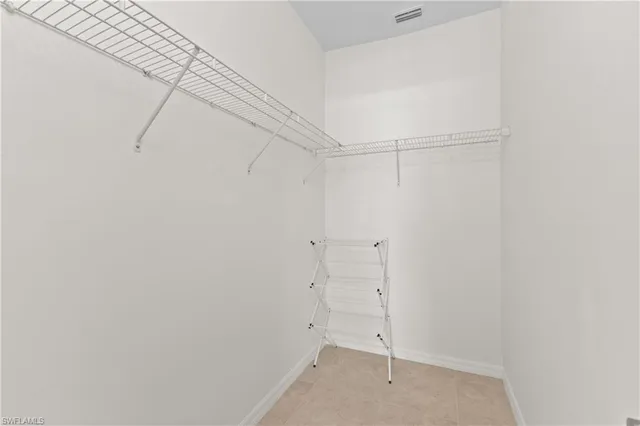 a view of an empty walk in closet