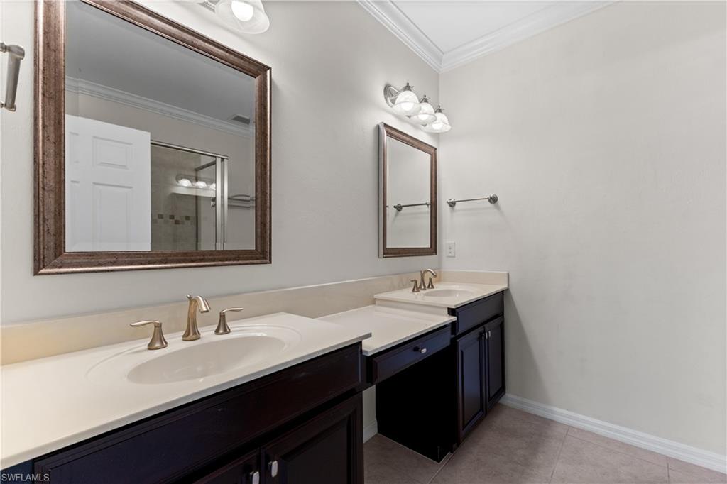 8531 Violeta Street, Unit 203 Estero, FL 34135 - Photo 17 of 35 a bathroom with double sink and a mirror