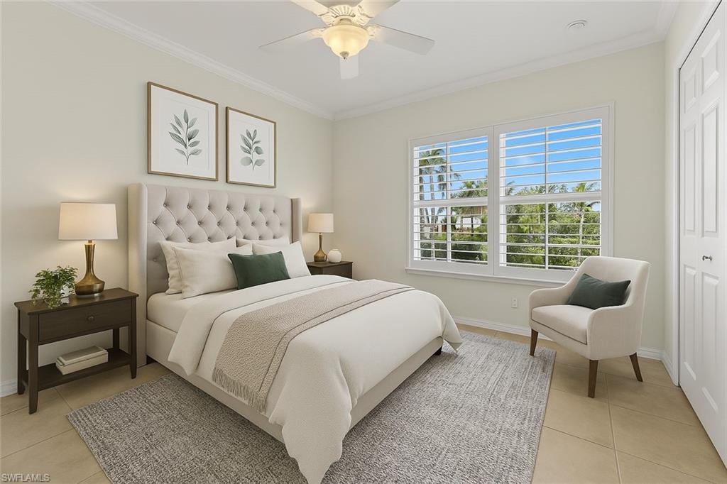 8531 Violeta Street, Unit 203 Estero, FL 34135 - Photo 19 of 35 a bedroom with a bed and a couch