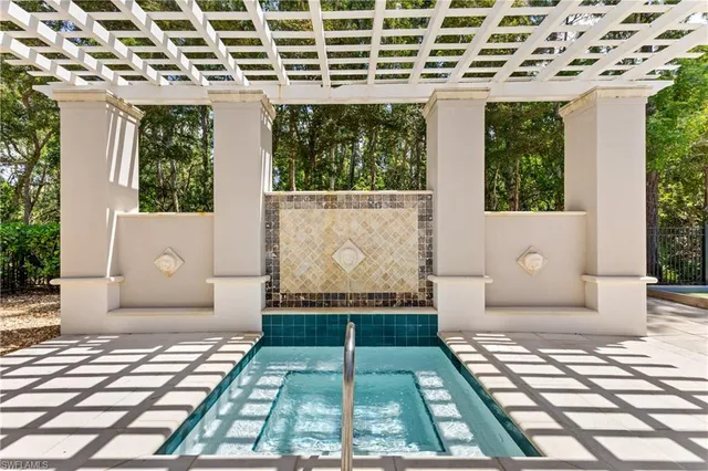 a living room with furniture a ceiling fan and a flat screen tv