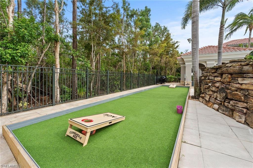 8531 Violeta Street, Unit 203 Estero, FL 34135 - Photo 32 of 35 a view of a backyard with sitting area