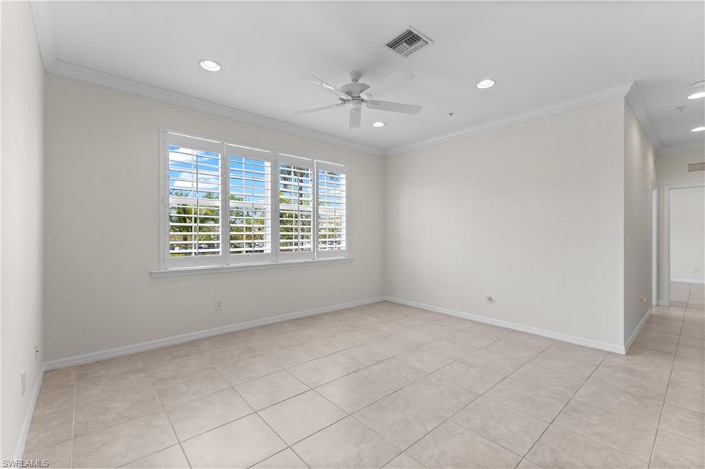 8531 Violeta Street, Unit 203 Estero, FL 34135 - Photo 5 of 35 an empty room with windows and fan
