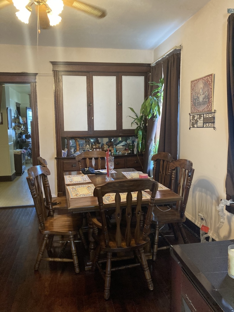 910 West 32nd Place Chicago, IL 60608 - Photo 17 of 28 a view of a dining room with furniture window and wooden floor