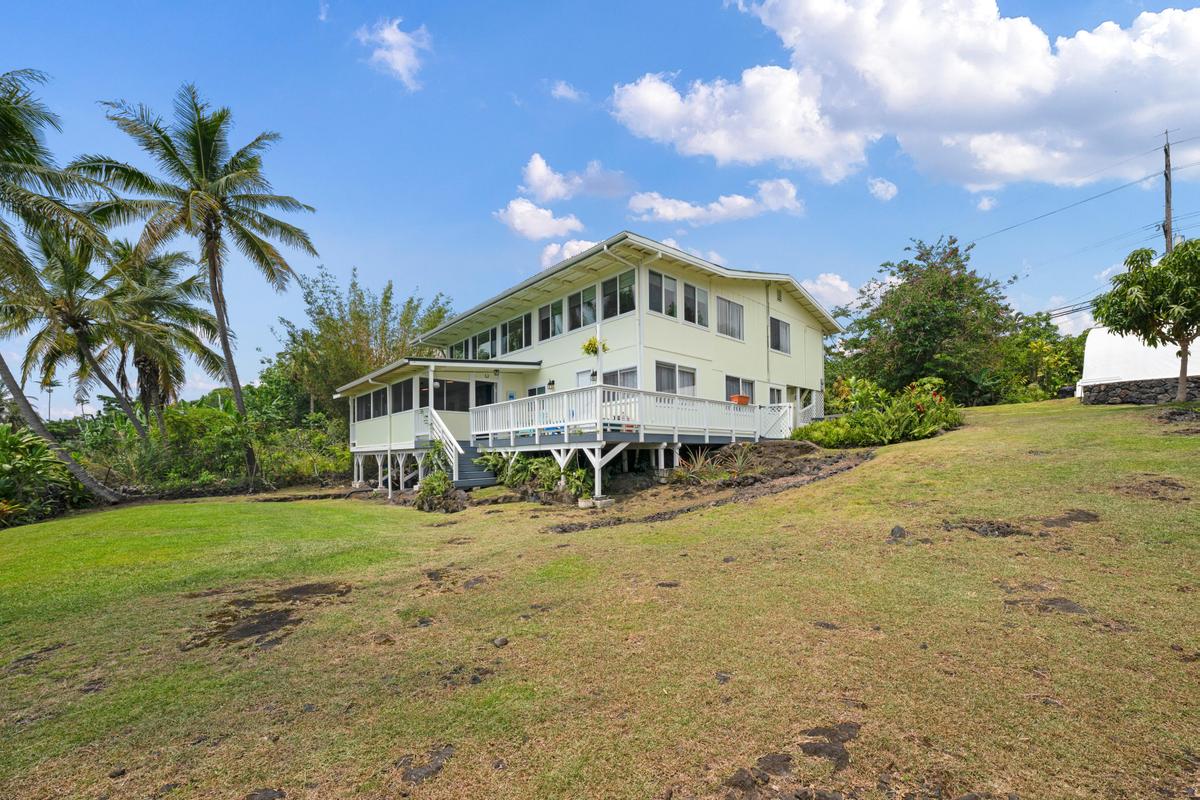 85-4563 Hawaii Belt Road Captain Cook, HI 96704 - Photo 1 of 30 a large tree in front of house