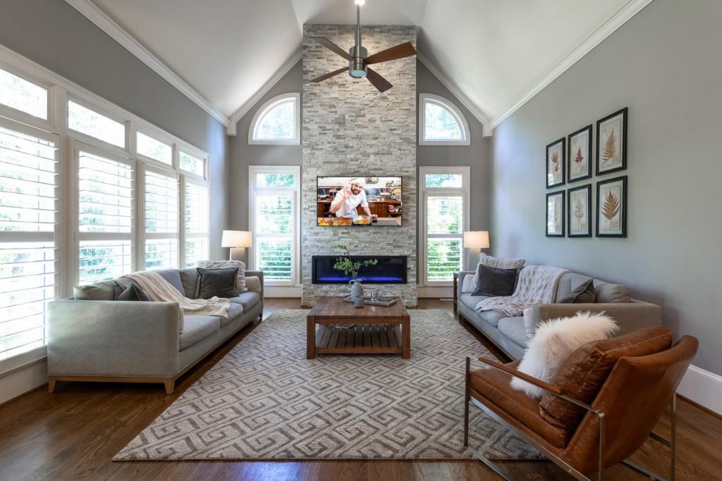 165 Autry Trail Alpharetta, GA 30022 - Photo 20 of 70 a living room with furniture a fireplace and a large window