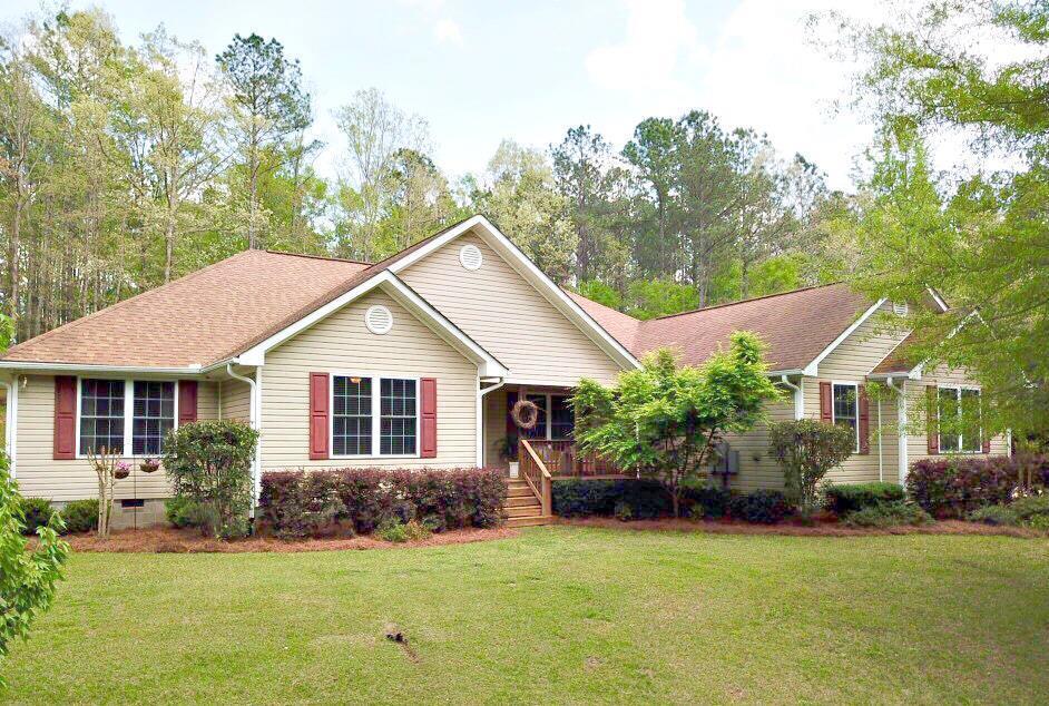 375 Old Cabaniss Road Forsyth, GA 31029 - Photo 1 of 23 a view of a house with a yard and potted plants