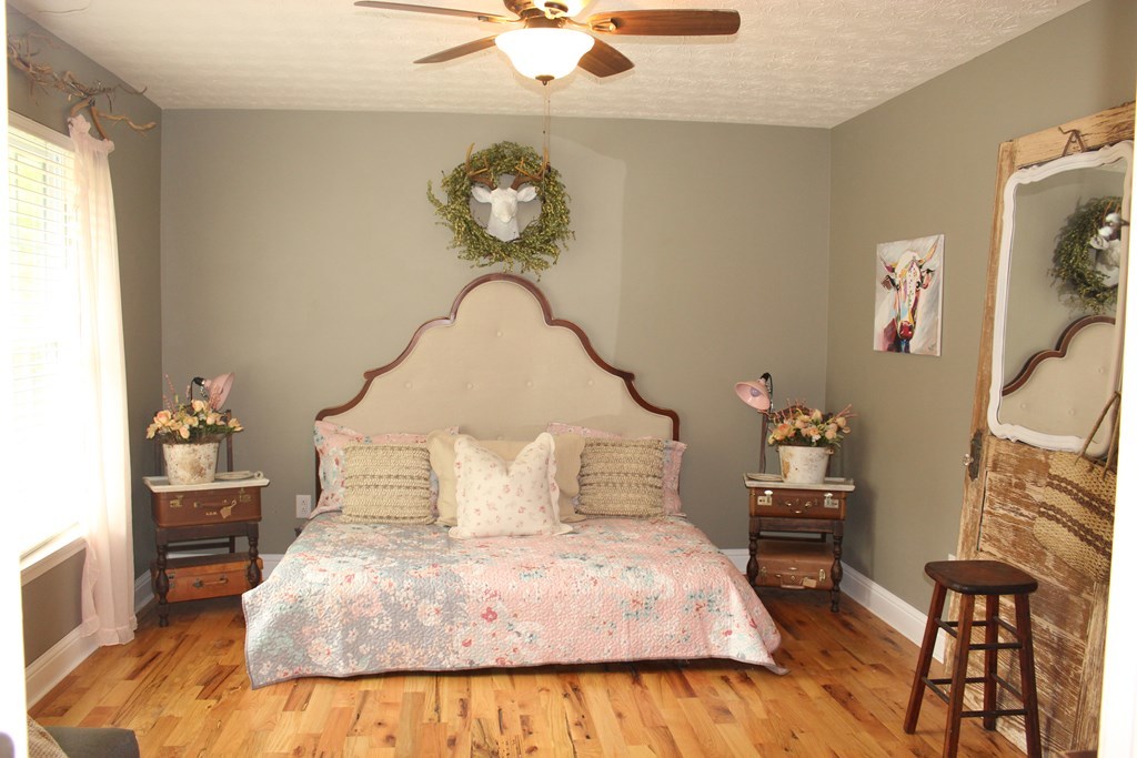 375 Old Cabaniss Road Forsyth, GA 31029 - Photo 12 of 23 a bedroom with a bed and a chandelier