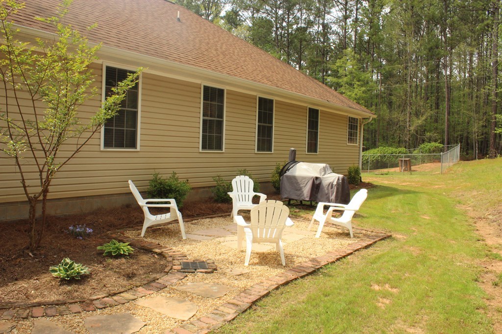 375 Old Cabaniss Road Forsyth, GA 31029 - Photo 20 of 23 a view of a patio with table and chairs and potted plants