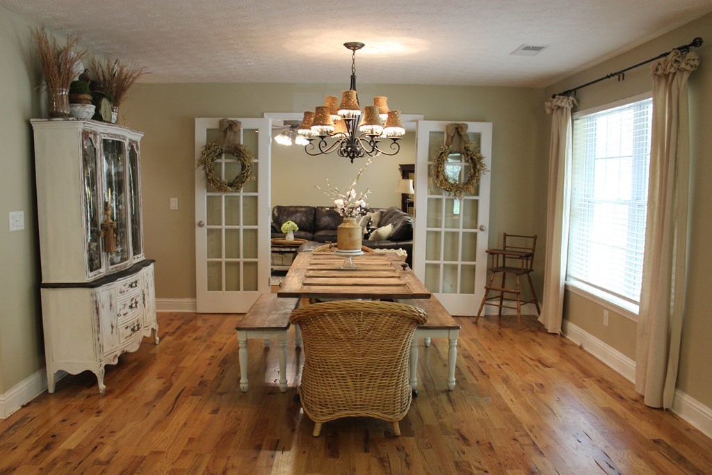 375 Old Cabaniss Road Forsyth, GA 31029 - Photo 8 of 23 a view of a dining room with furniture and wooden floor