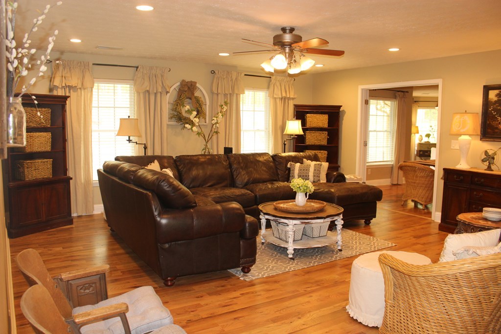 375 Old Cabaniss Road Forsyth, GA 31029 - Photo 9 of 23 a living room with furniture and a large window