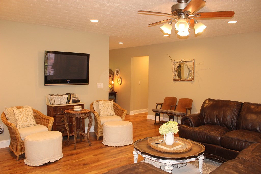 375 Old Cabaniss Road Forsyth, GA 31029 - Photo 10 of 23 a living room with furniture and a flat screen tv