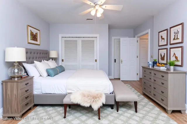 a bedroom with a bed and a dresser