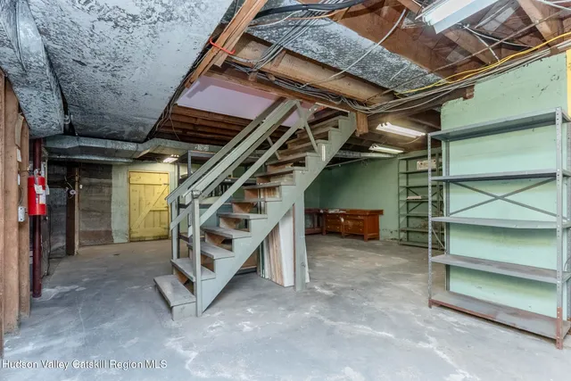 a view of an empty room with stairs