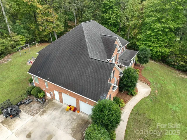 an aerial view of a house with outdoor space