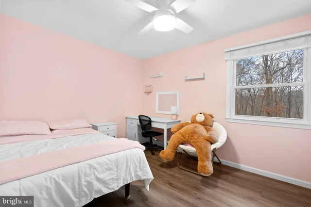 a bedroom with bed and a window