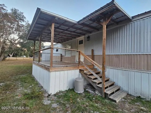 a view of entryway with wooden stairs