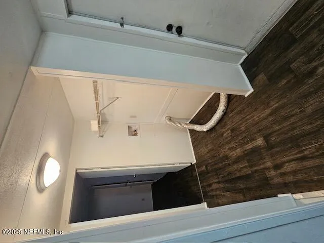 a view of staircase with wooden floor