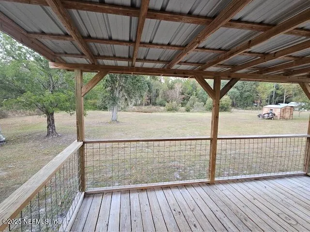 a view of outdoor space with wooden deck