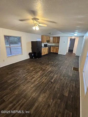 a view of a kitchen with a sink and a dishwasher cabinets