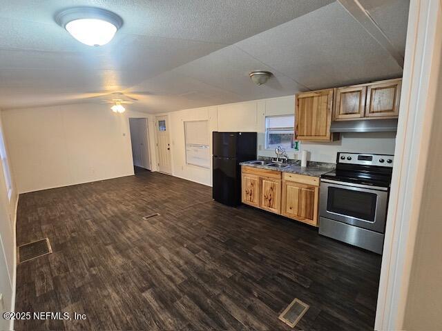 8766 Southwest 87th Place Lake Butler, FL 32054 - Photo 8 of 13 a kitchen with stainless steel appliances a stove a refrigerator sink and cabinets