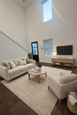 a living room with furniture and a flat screen tv