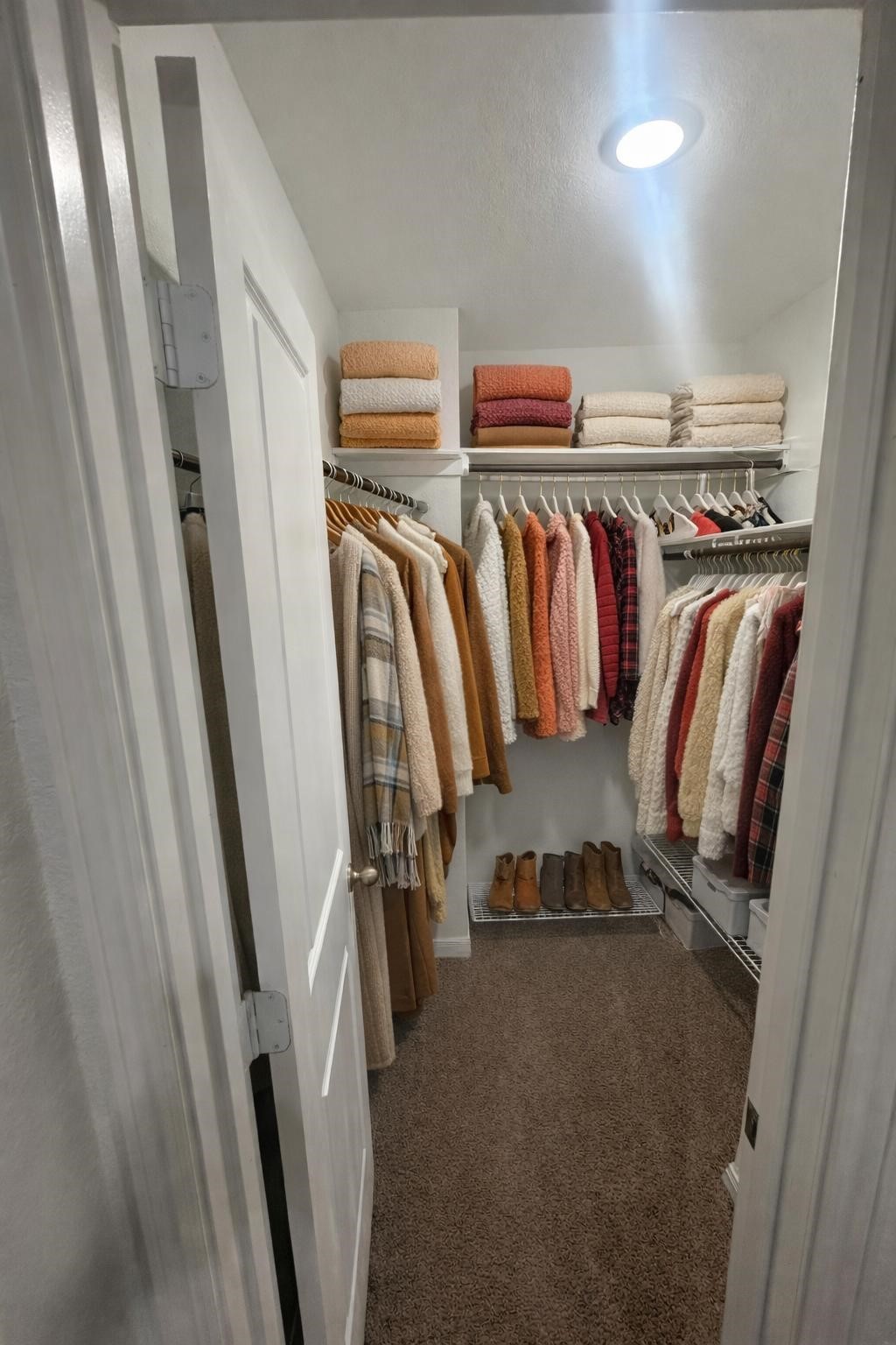 16367 Jasmine Marie Place Conroe, TX 77306 - Photo 4 of 11 a view of walk in closet with clothes and shoes