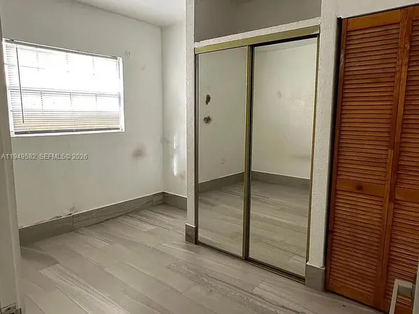 a bathroom with a shower and a toilet