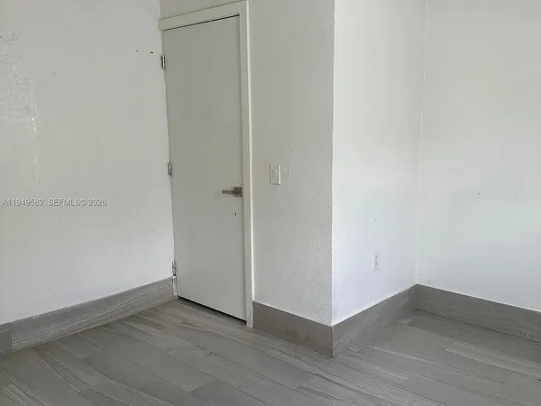 a bathroom with a sink a mirror and shower
