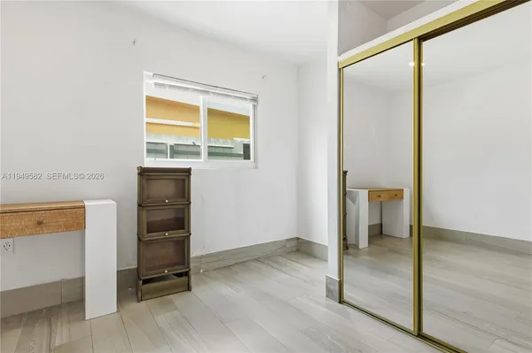 a view of walk in closet with empty room