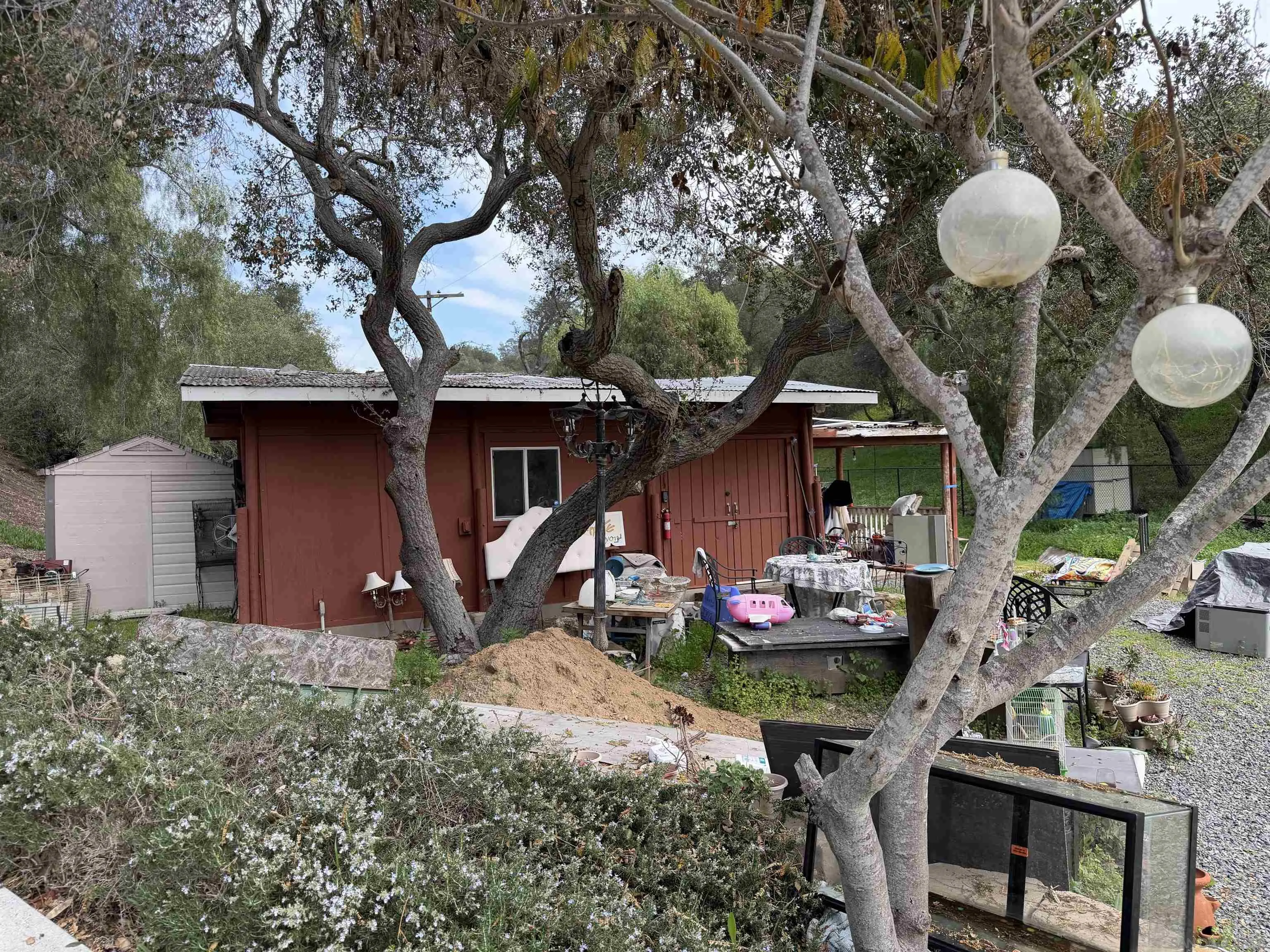 2416 Gird Road Fallbrook, CA 92028 - Photo 16 of 17 a view of a chairs and table in a backyard