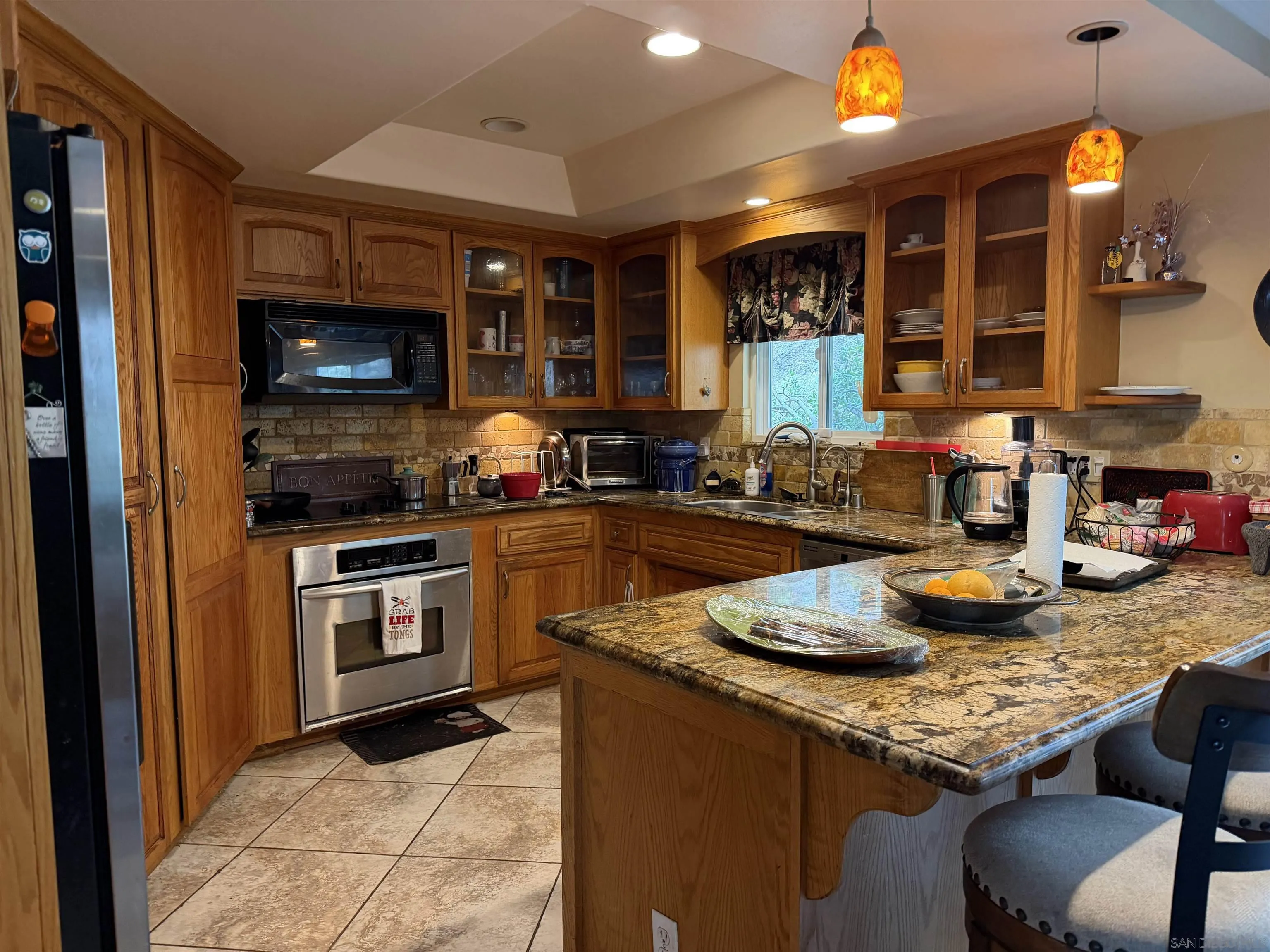 2416 Gird Road Fallbrook, CA 92028 - Photo 9 of 17 a kitchen with granite countertop lots of counter top space