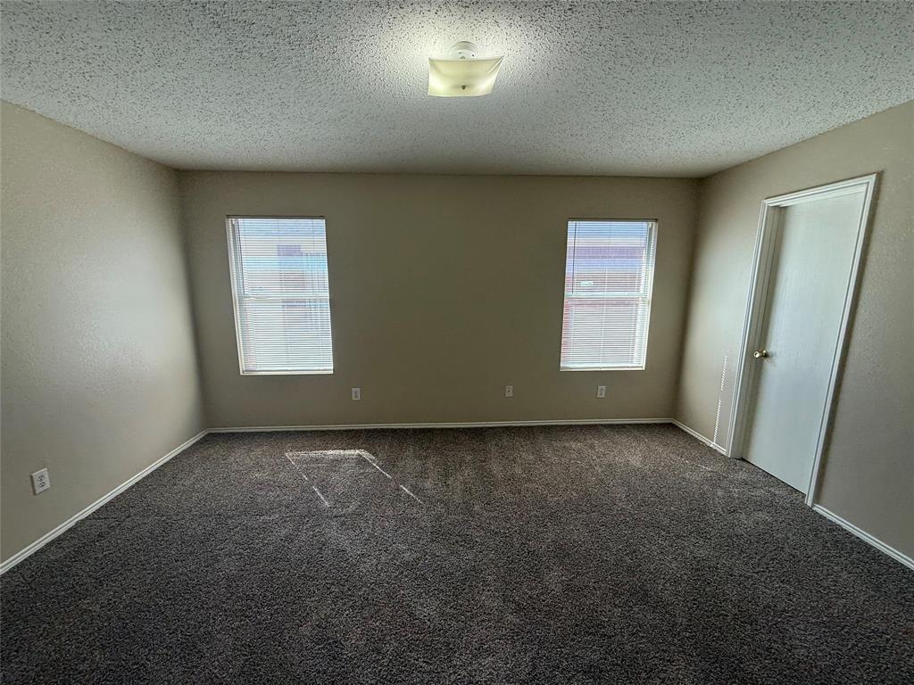 7541 Marietta Lane Dallas, TX 75241 - Photo 9 of 10 an empty room with windows