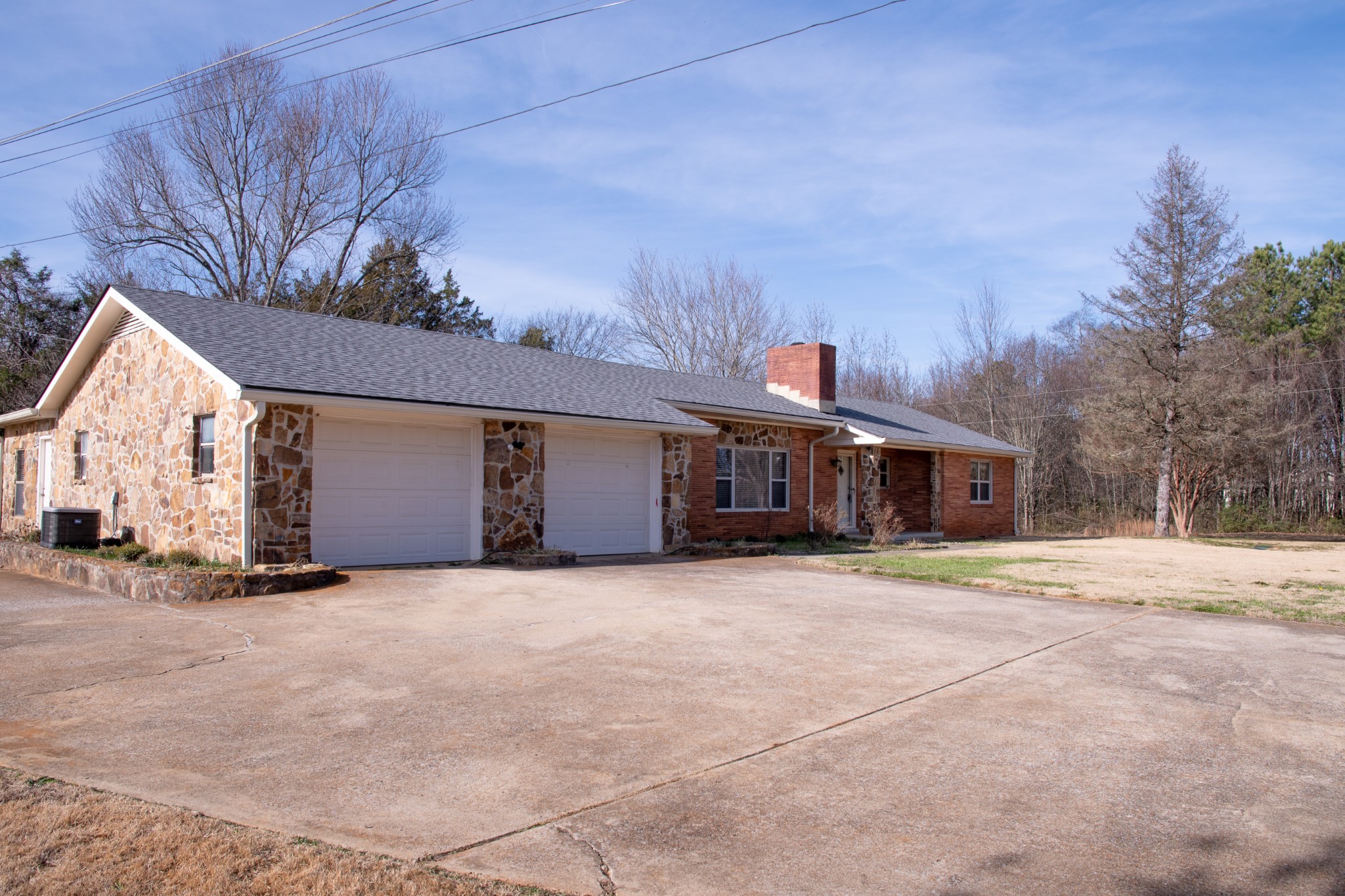 340 Jeff Road Northwest Huntsville, AL 35806 - Photo 2 of 18 a front view of a house with a yard and garage