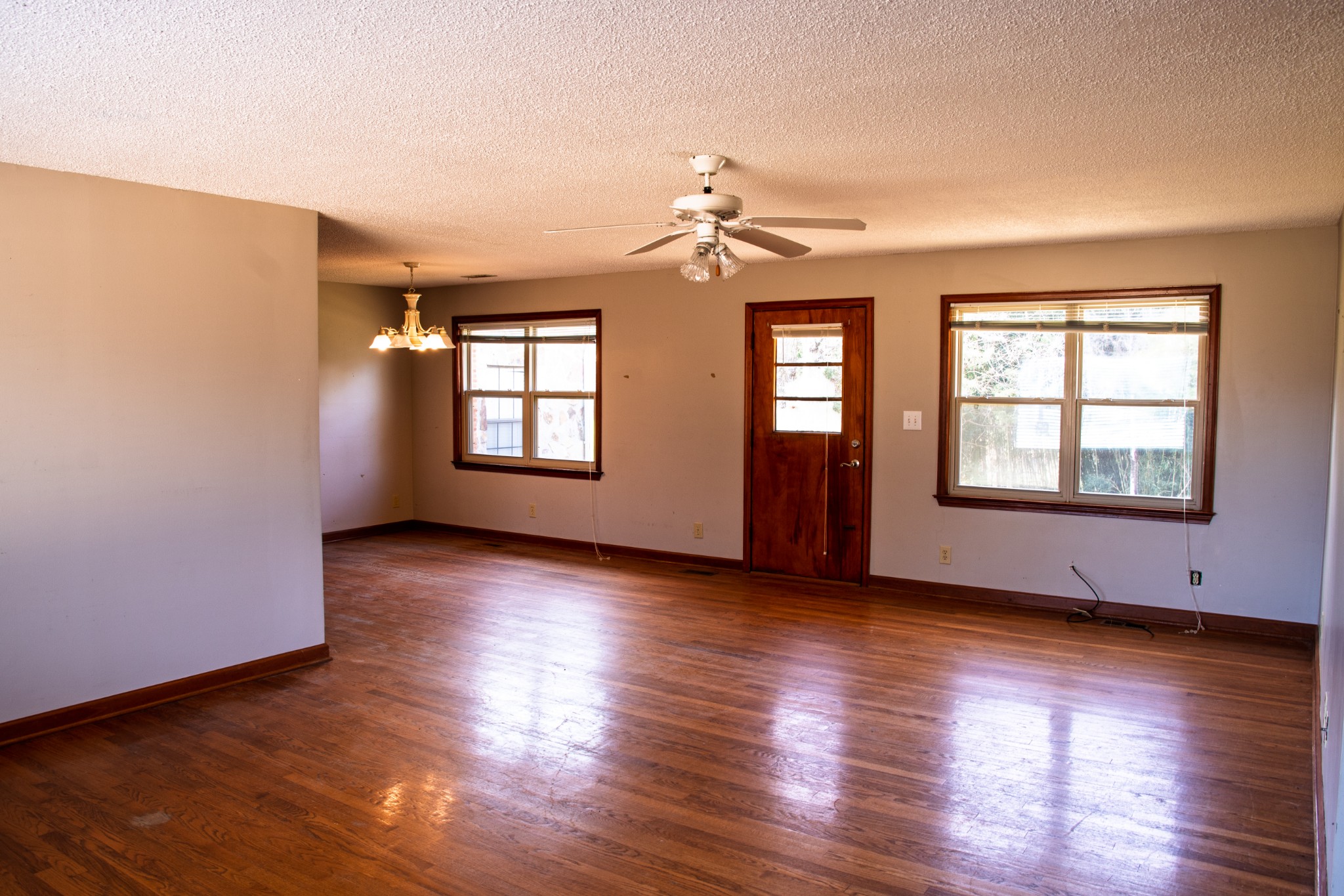 340 Jeff Road Northwest Huntsville, AL 35806 - Photo 4 of 18 a view of an empty room with window and wooden floor