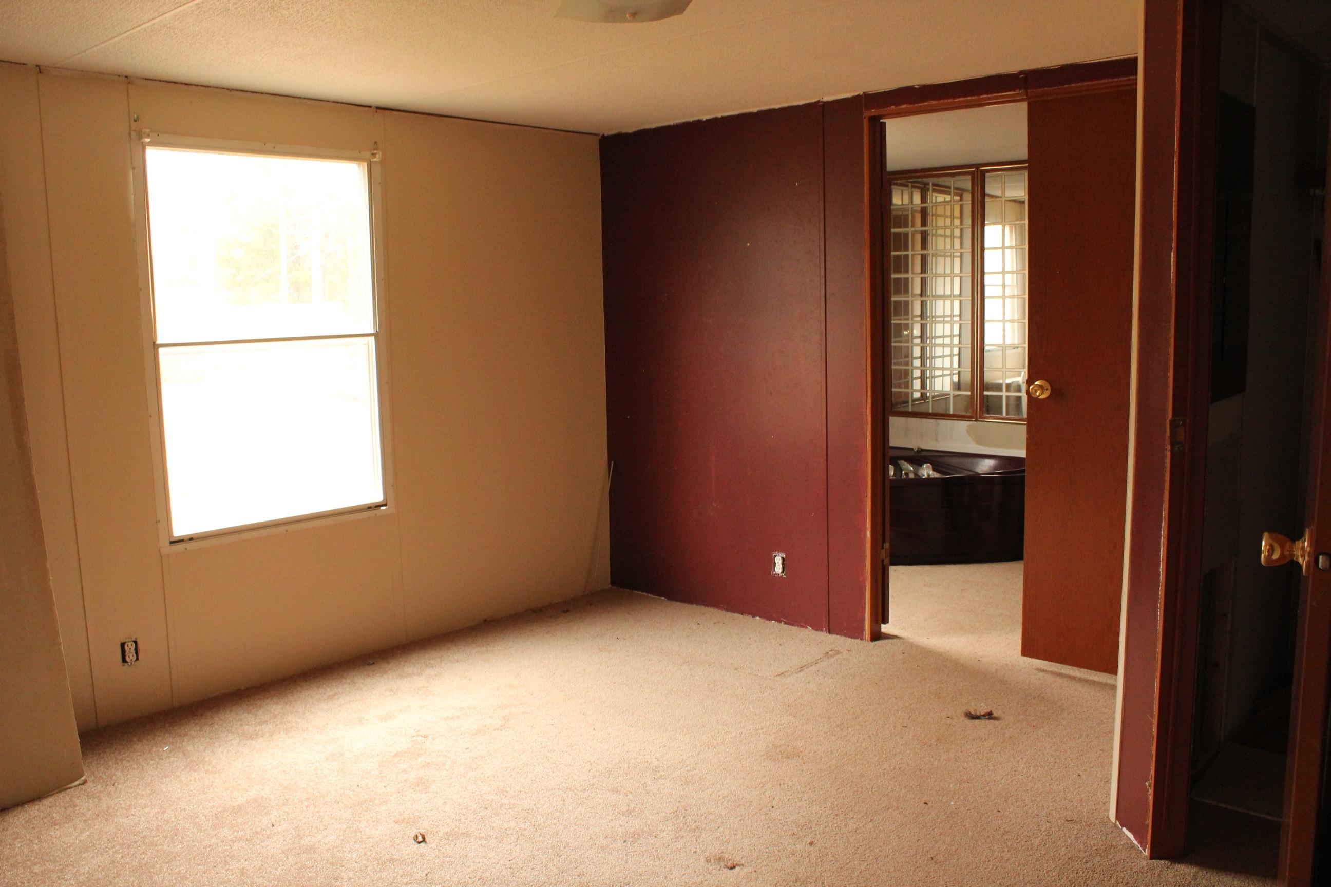 842 Countyline Church Road Southeast Floyd, VA 24091 - Photo 4 of 4 an empty room with windows and closet
