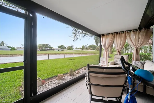 a view of a patio with dining table and chairs