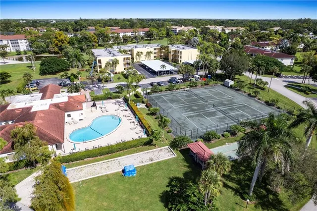 an aerial view of a house with garden space and houses