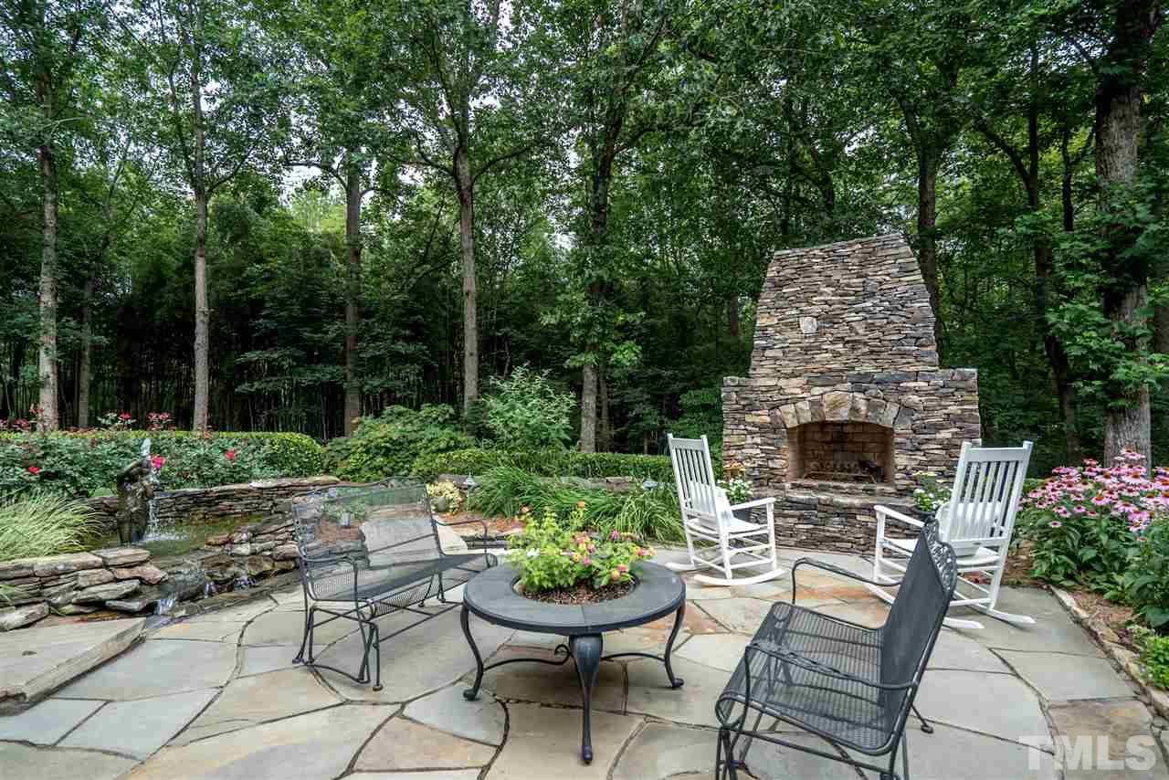 9904 Mathias Court Raleigh, NC 27615 - Photo 22 of 25 a backyard of a house with yard barbeque oven and outdoor seating
