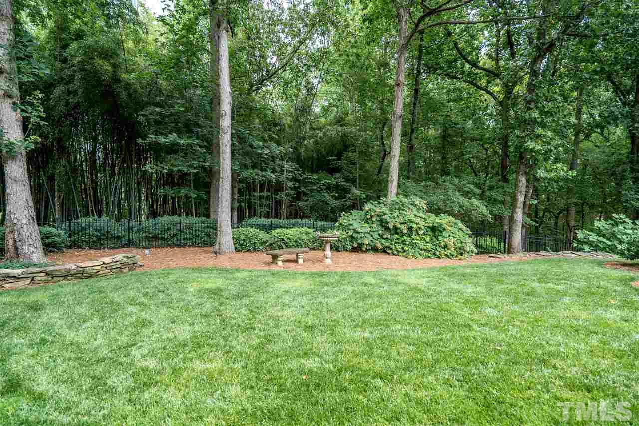 9904 Mathias Court Raleigh, NC 27615 - Photo 24 of 25 a view of backyard with swimming pool and green space