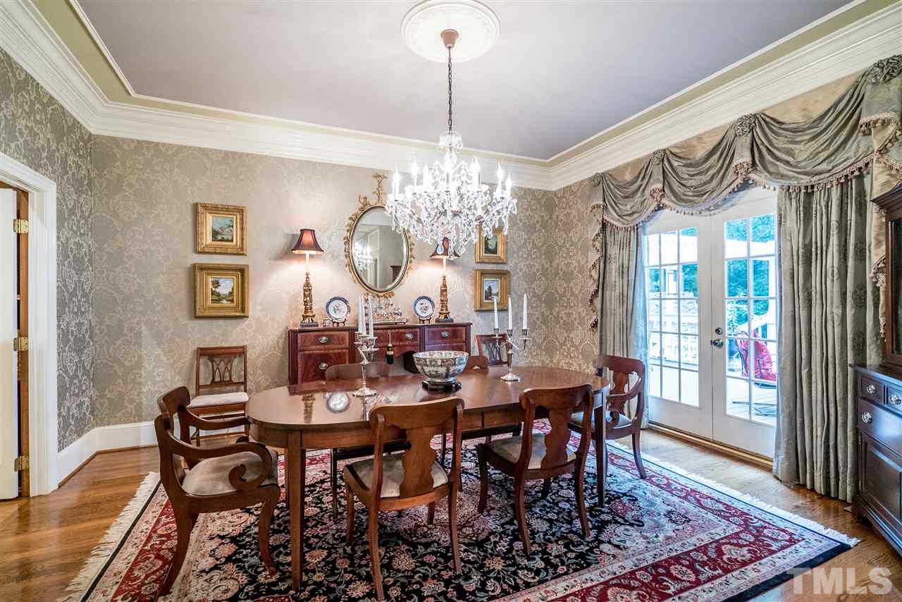9904 Mathias Court Raleigh, NC 27615 - Photo 5 of 25 a view of a dining room with furniture window and wooden floor