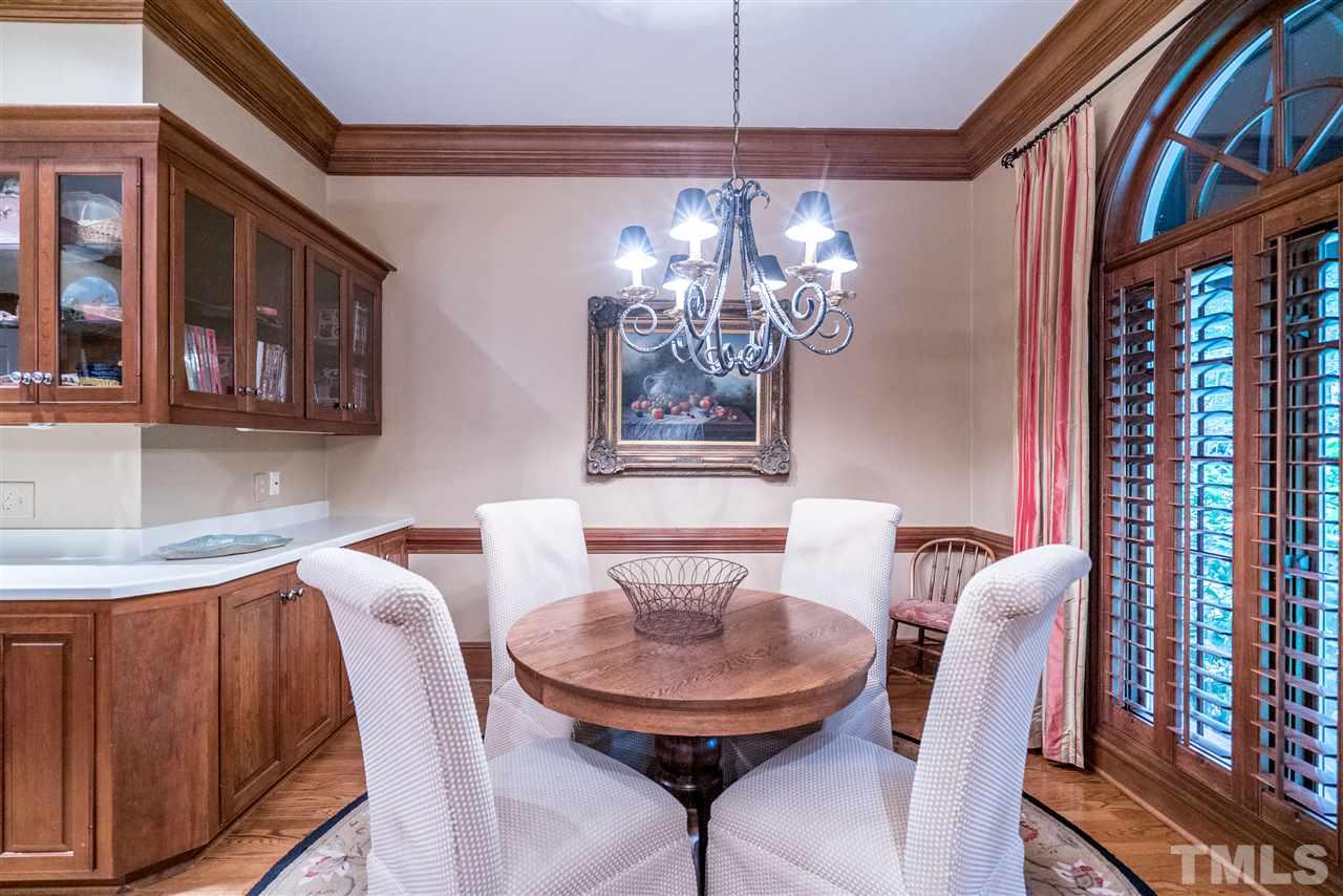 9904 Mathias Court Raleigh, NC 27615 - Photo 9 of 25 a view of a dining room with furniture and chandelier