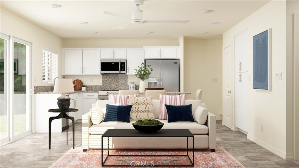 7408 Olive Grv Street Riverside, CA 92507 - Photo 1 of 1 a living room with furniture and a wooden floor