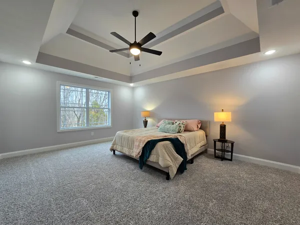 a bedroom with a bed and window