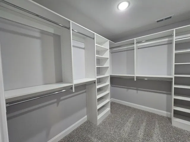 a view of an empty walk in closet