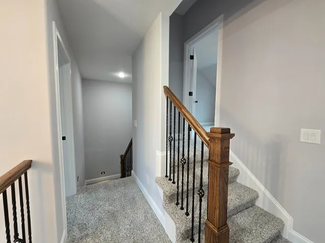 a view of a hallway with staircase