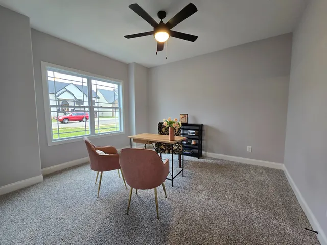a workspace with furniture and a window