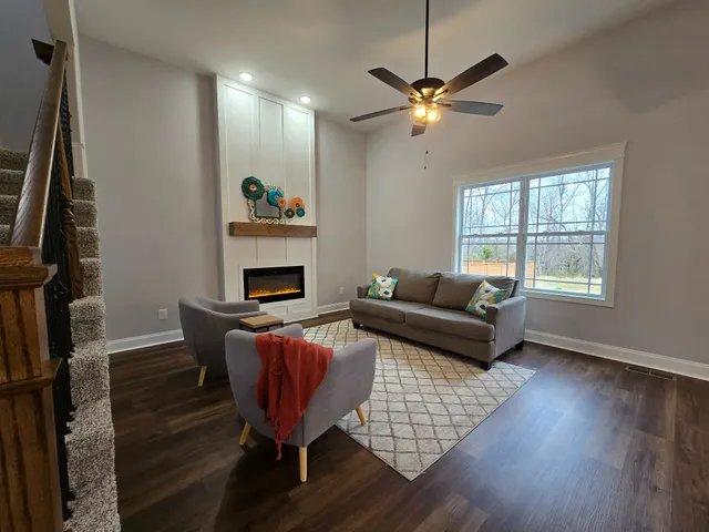 a living room with furniture and a window