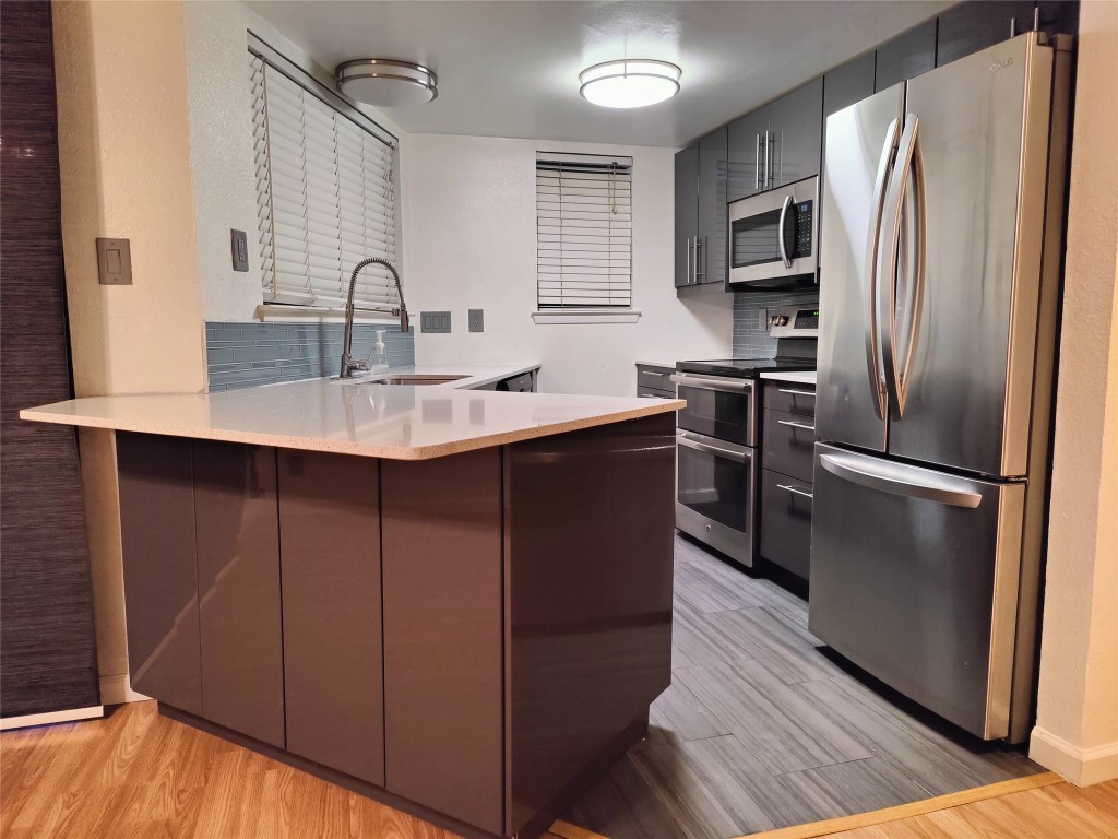 2500 Burleson Road, Unit 315 Austin, TX 78741 - Photo 1 of 21 Beautifully updated Kitchen with stainless steel appliances, backsplash, and a breakfast area