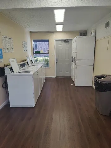 a white refrigerator freezer sitting inside of a kitchen