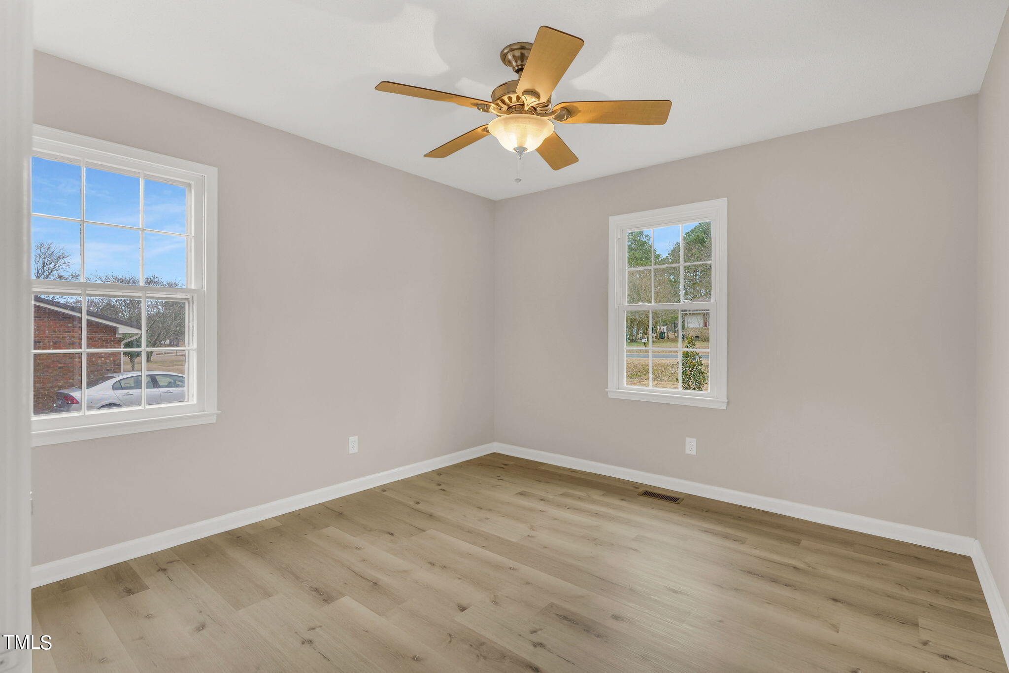1073 Brick Mill Road Coats, NC 27521 - Photo 17 of 32 an empty room with window and ceiling fan